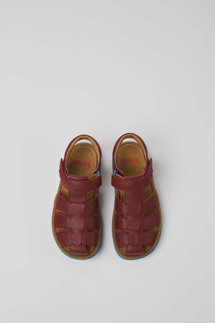 Overhead view of Bicho Burgundy leather sandals for kids