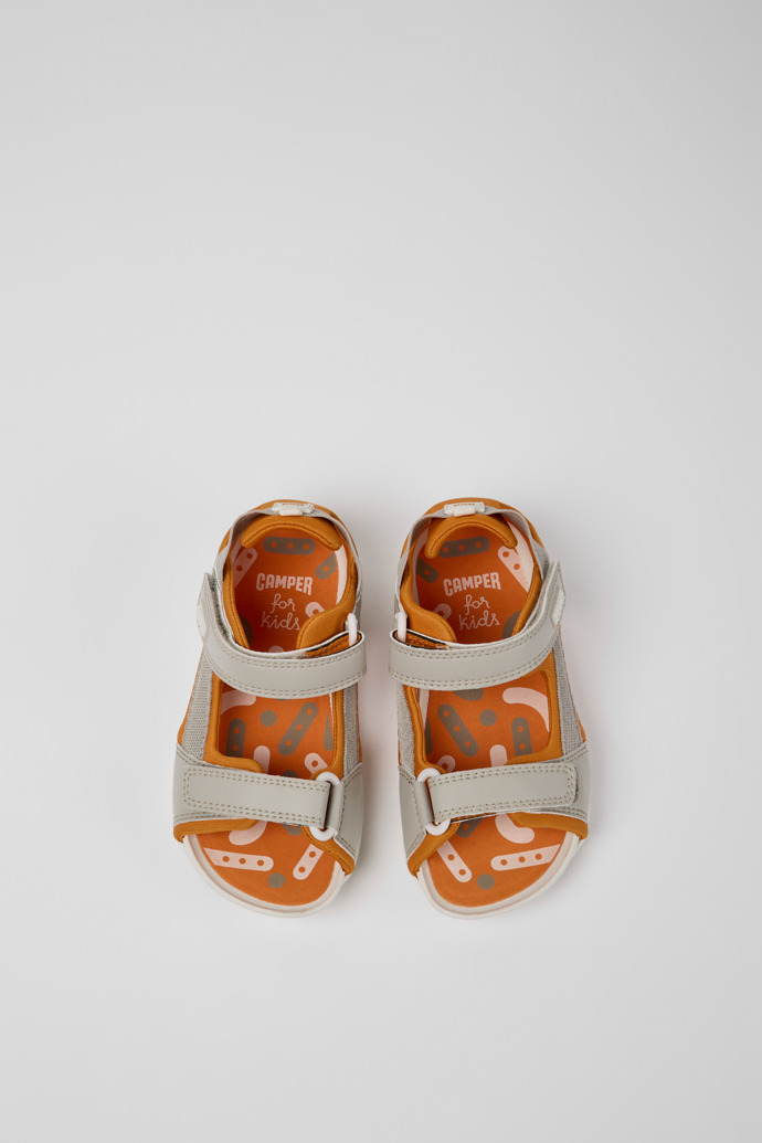 Overhead view of Ous Grey and orange sandals for kids