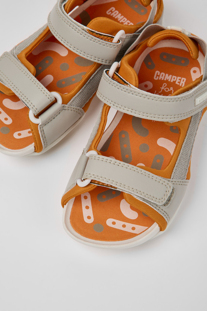 Close-up view of Ous Grey and orange sandals for kids