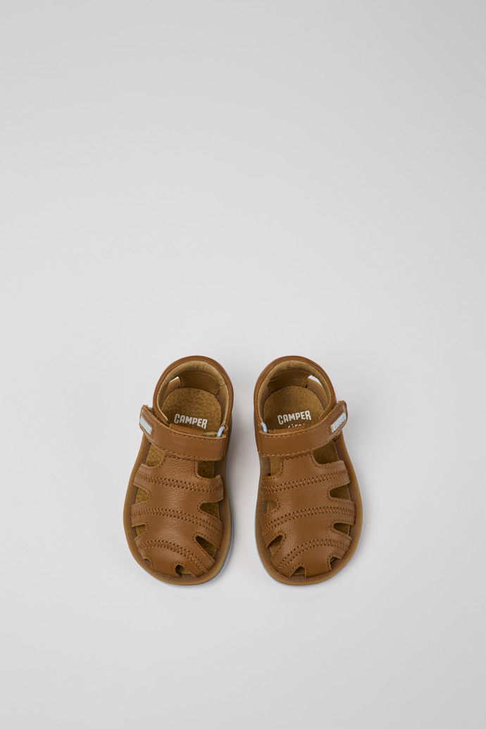Overhead view of Bicho Brown leather sandals for kids