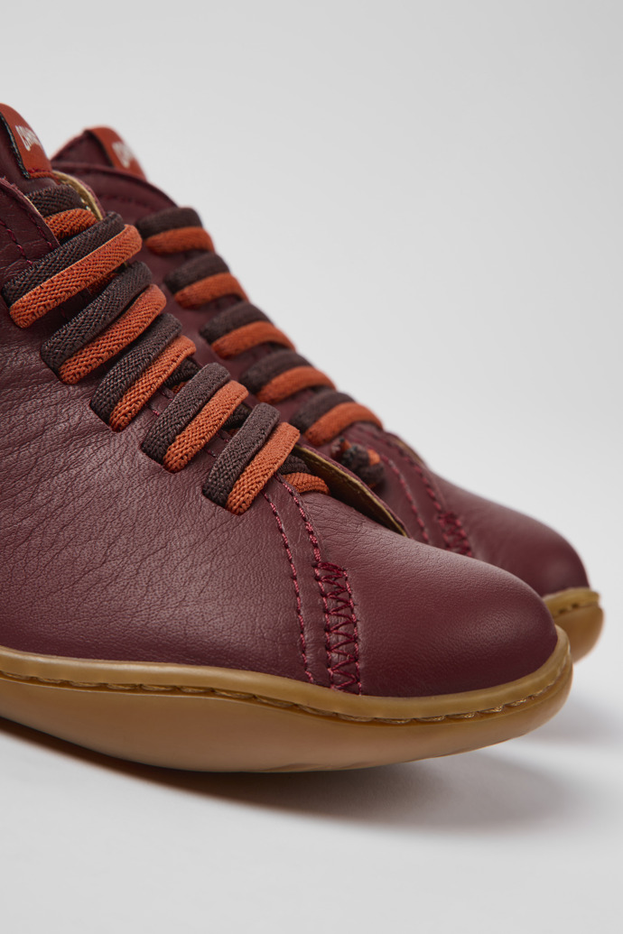 Close-up view of Peu Burgundy leather ankle boots for kids