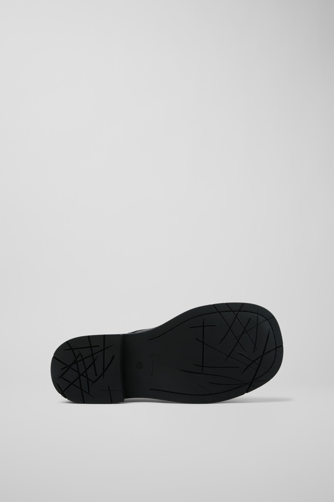 The soles of Mil 1978 Black leather shoes