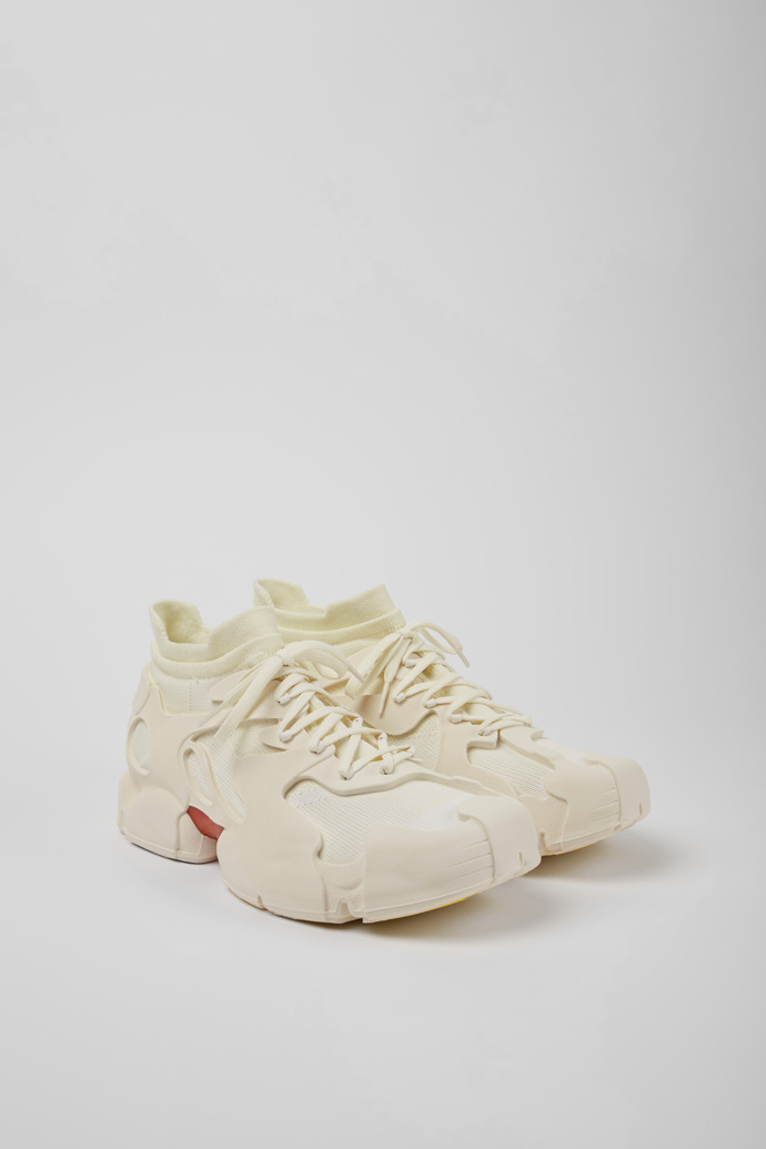 Front view of Tossu White caged sneakers