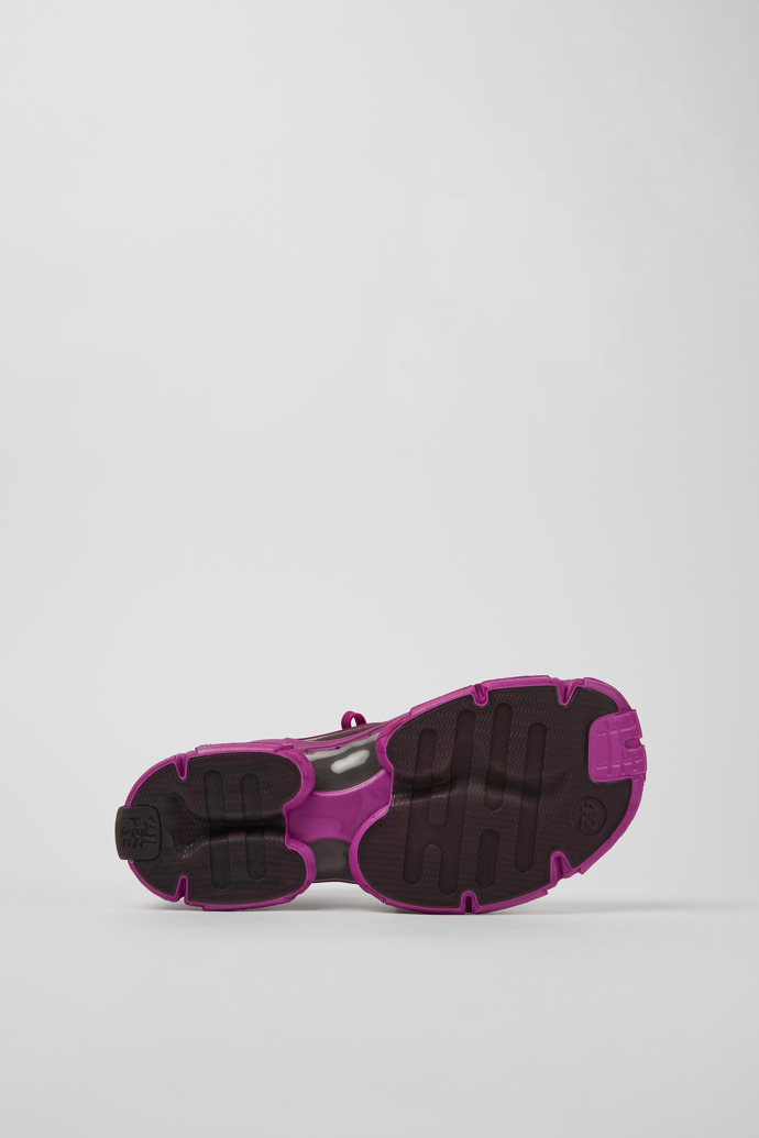 The soles of Tossu Purple caged sneakers