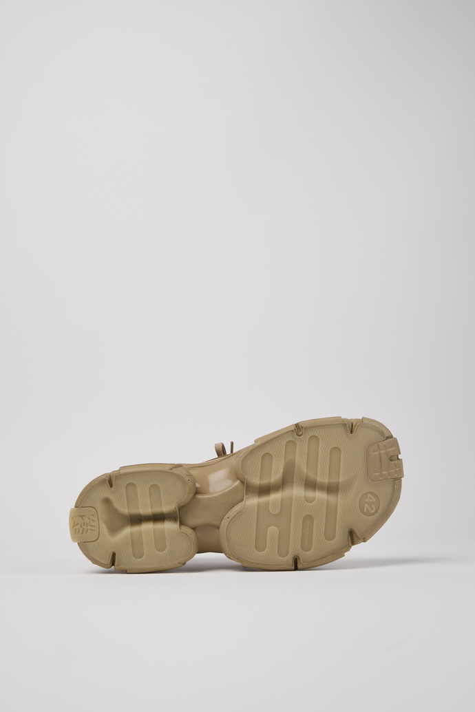 The soles of Tossu Beige Caged Sneakers