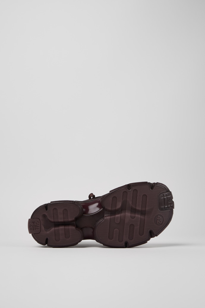 The soles of Tossu Burgundy Caged Sneakers