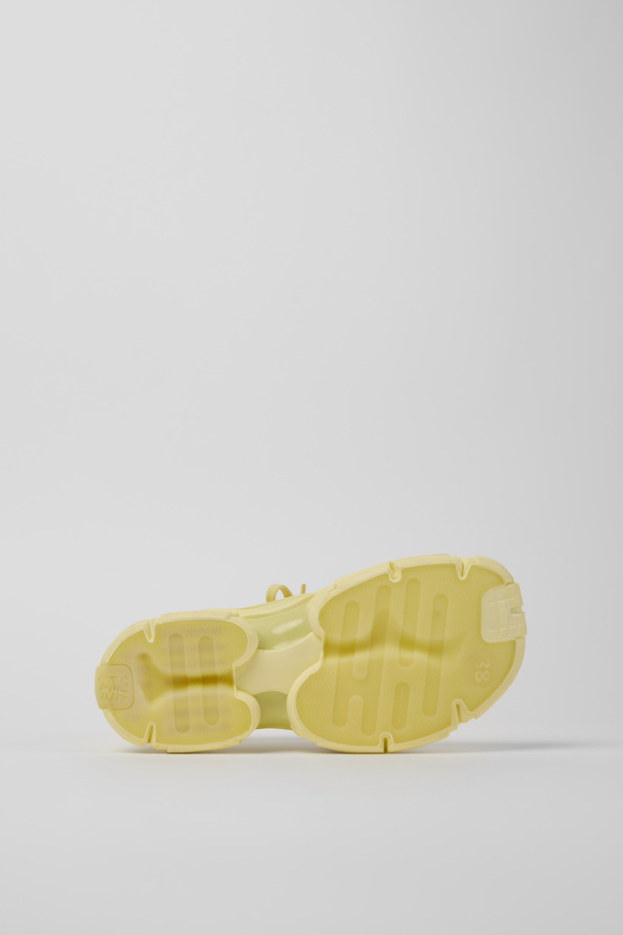 The soles of Tossu Yellow Caged Sneakers