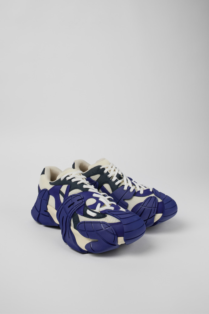 Front view of Tormenta Blue and white sneakers