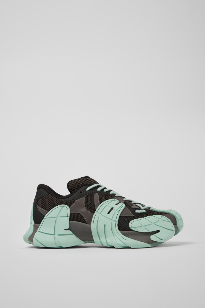 Side view of Tormenta Gray and light green sneakers