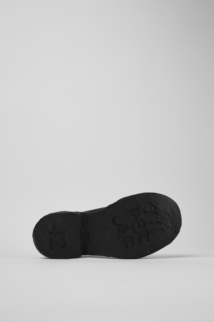 The soles of Vamonos Black Leather Wallabee Shoe