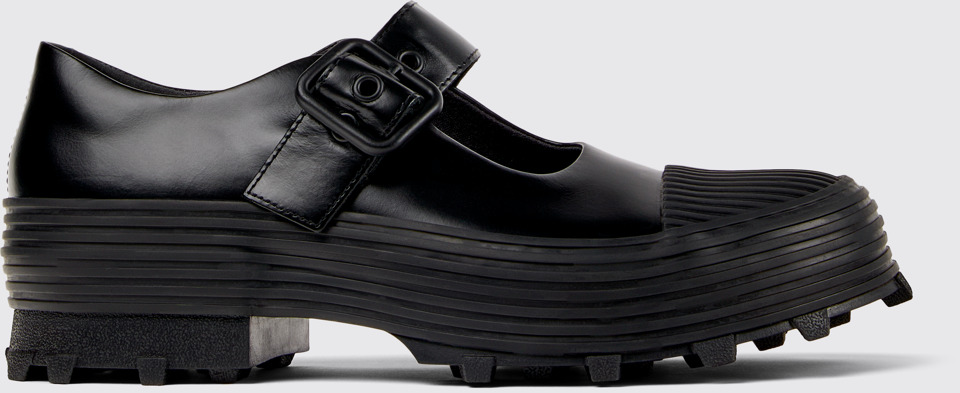 Side view of TRAKTORI Black Leather Mary Jane Clogs