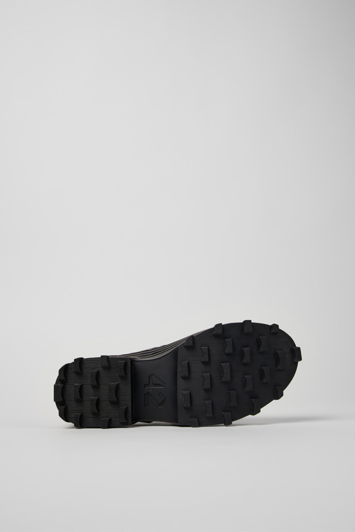 The soles of Traktori Black Leather Mary Jane Clogs