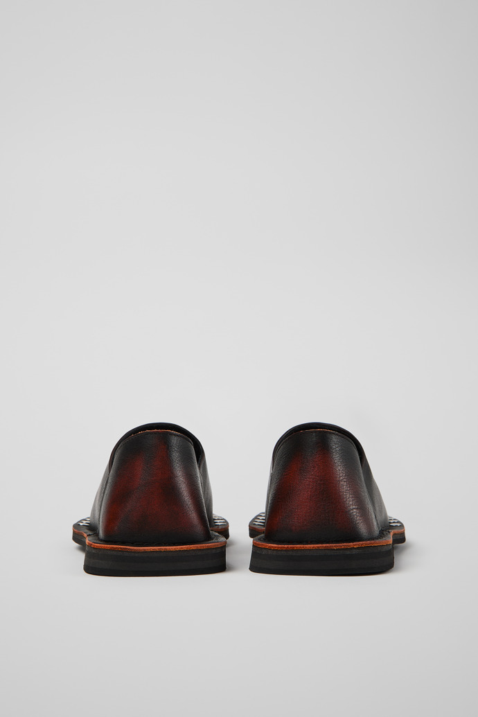 Back view of MENOSMAL BLACK-ORANGE