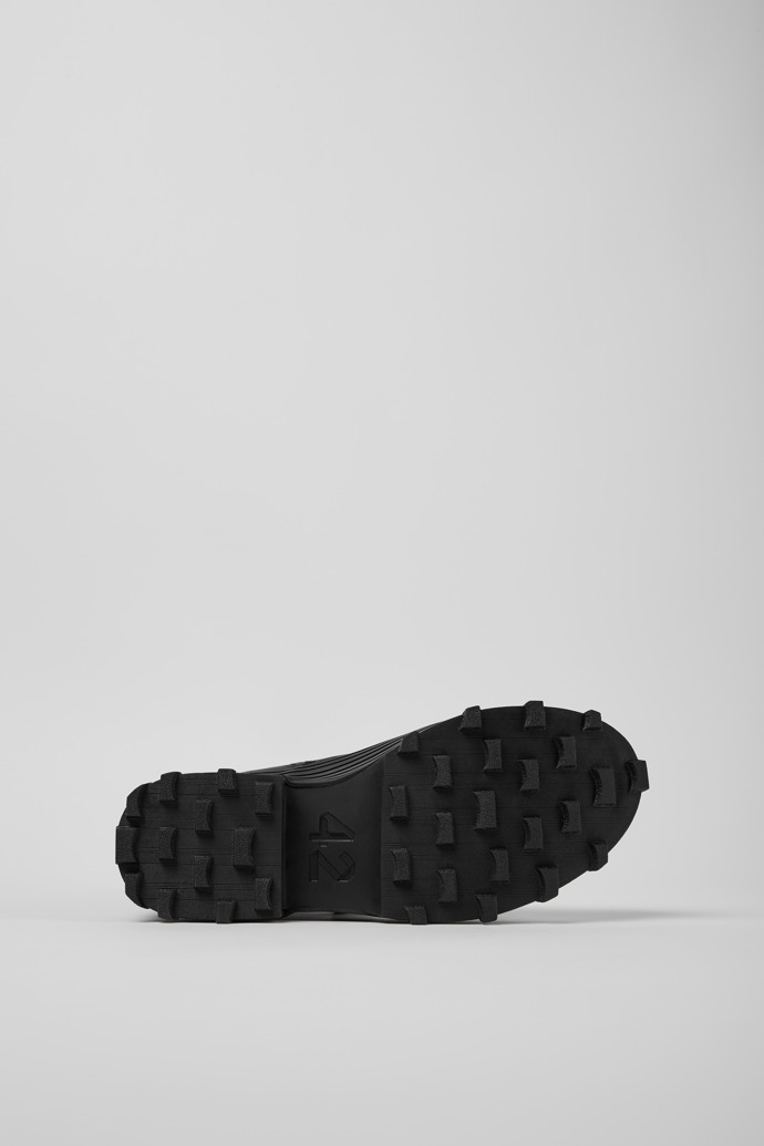 The soles of Traktori Black leather boots