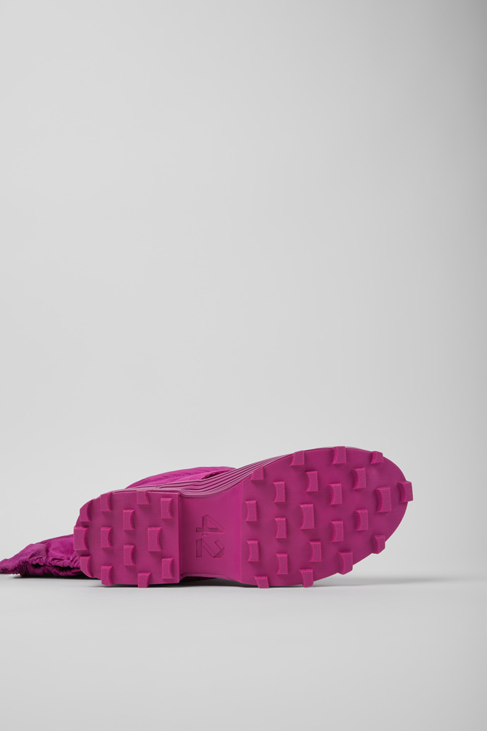 The soles of Traktori Purple padded high boots