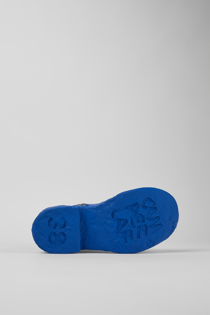 The soles of Vamonos Blue Leather Zip Bootie