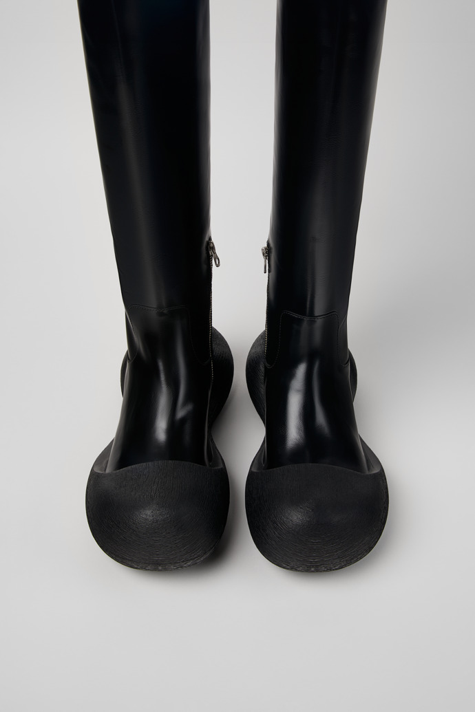 Overhead view of Caramba Black Leather Knee-High Boots