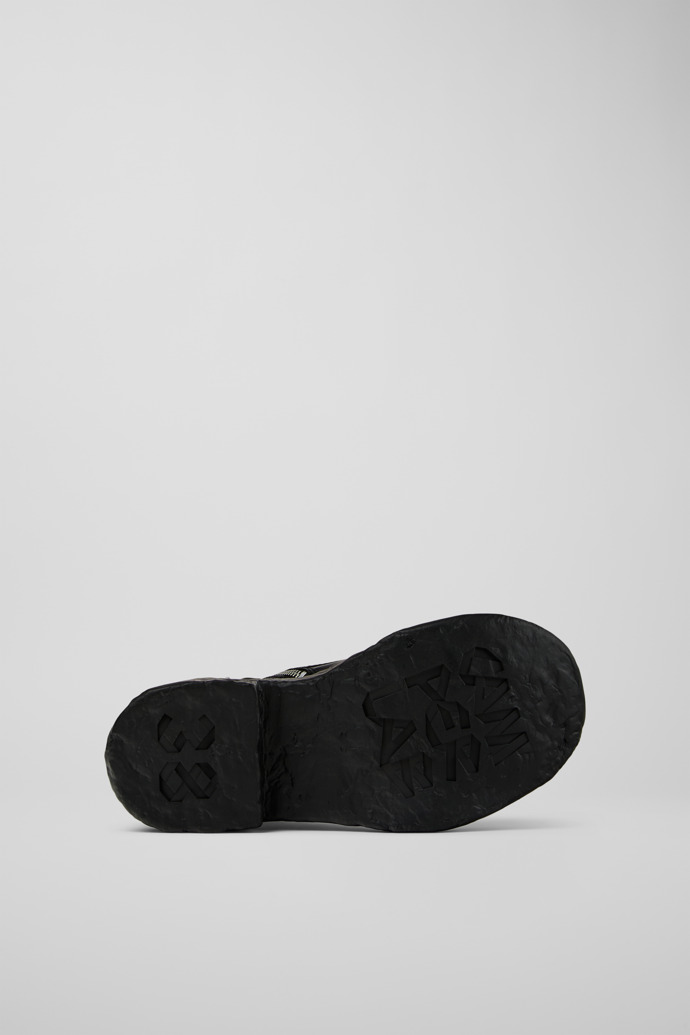 The soles of CAMPERLAB VAMONOS Black Leather Medium Boots