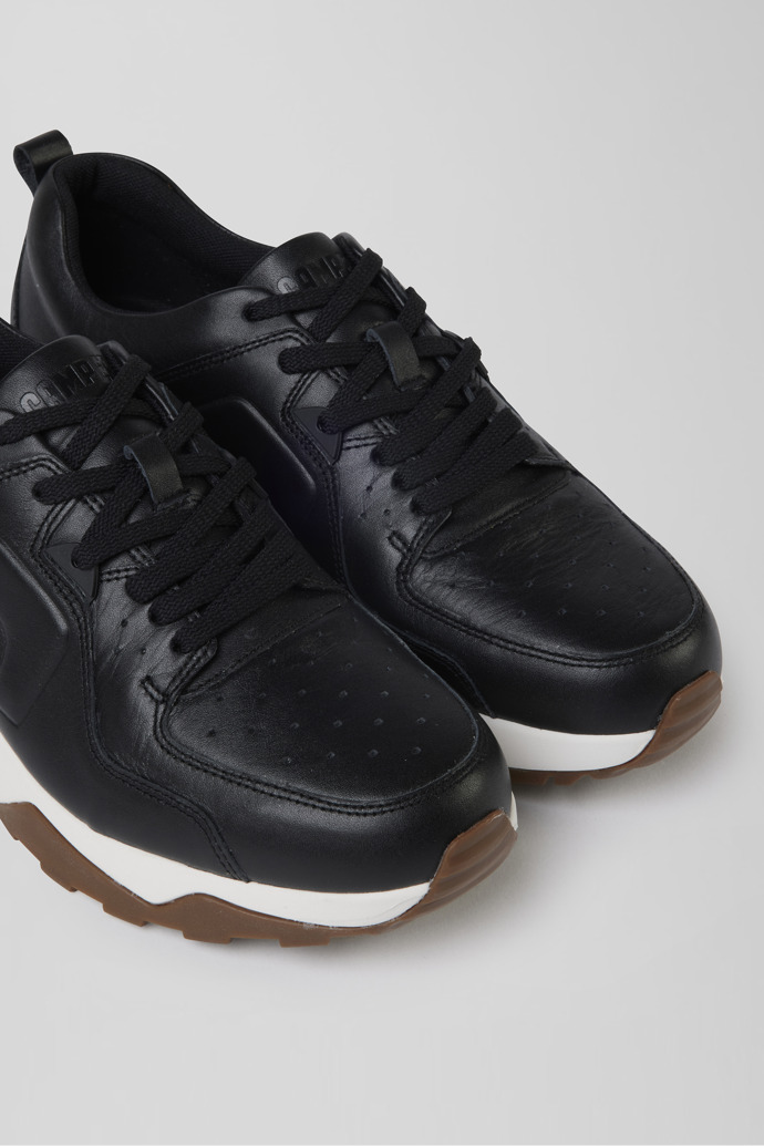Close-up view of Caddie Black  leather golf sneakers