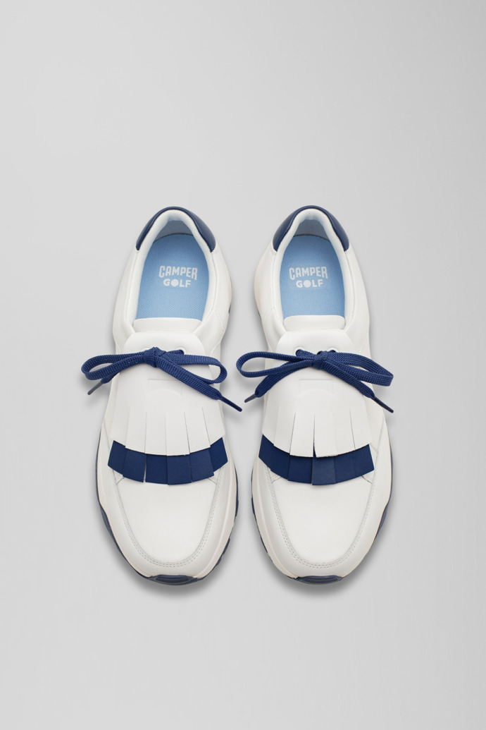 Overhead view of Spackler White and navy leather golf sneakers