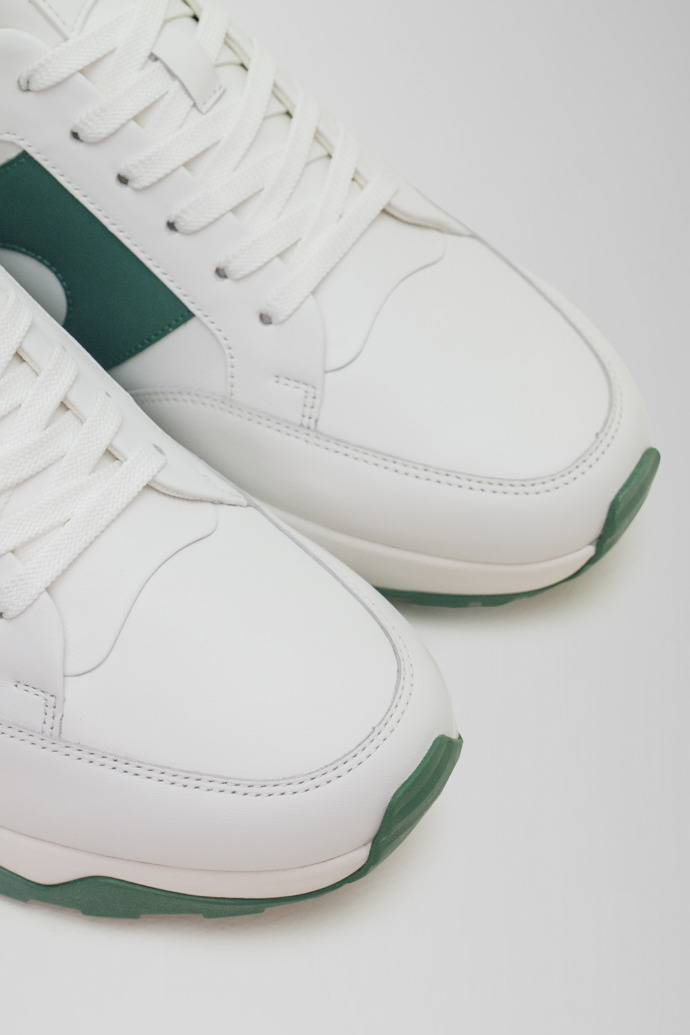 Close-up view of Spackler White and green leather golf sneakers