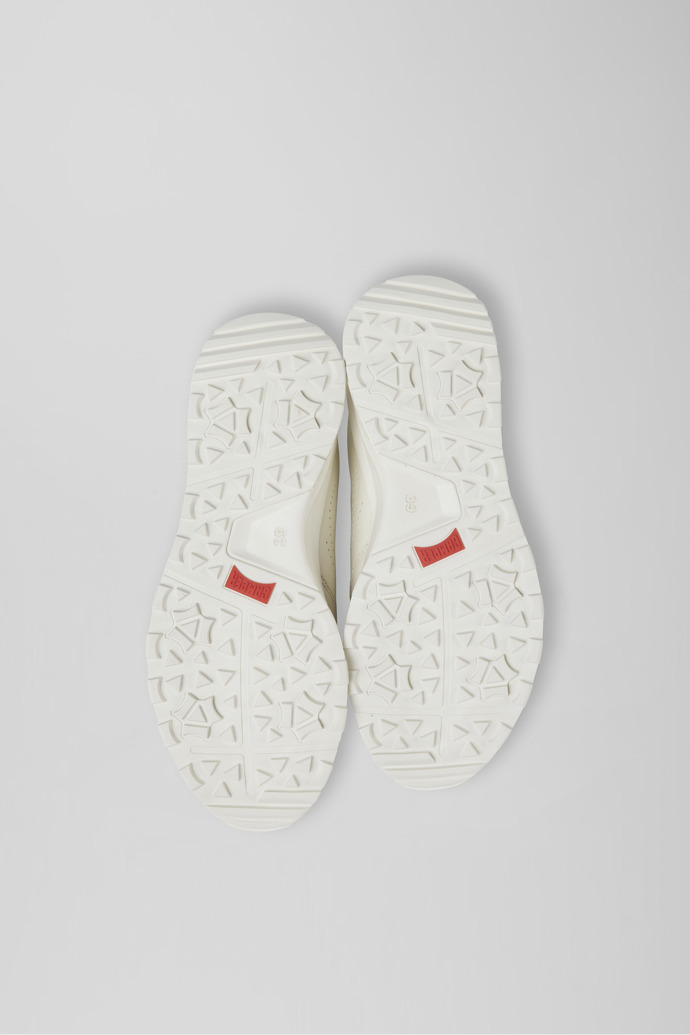 The soles of Looper Ivory white  leather golf sneakers
