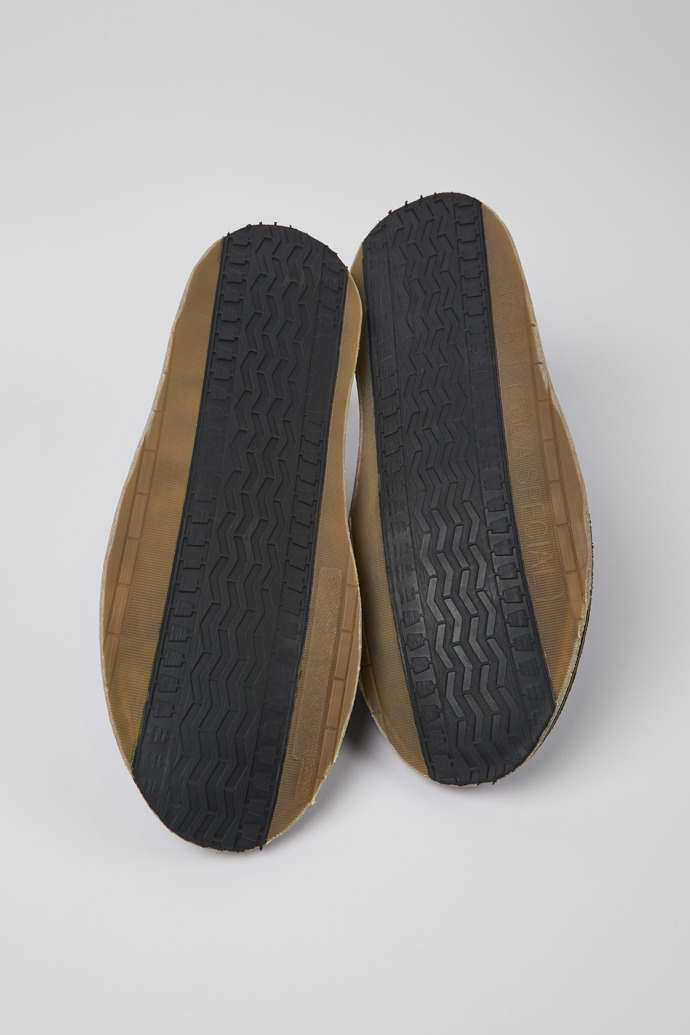 The soles of ReCrafted Black textile shoes for men