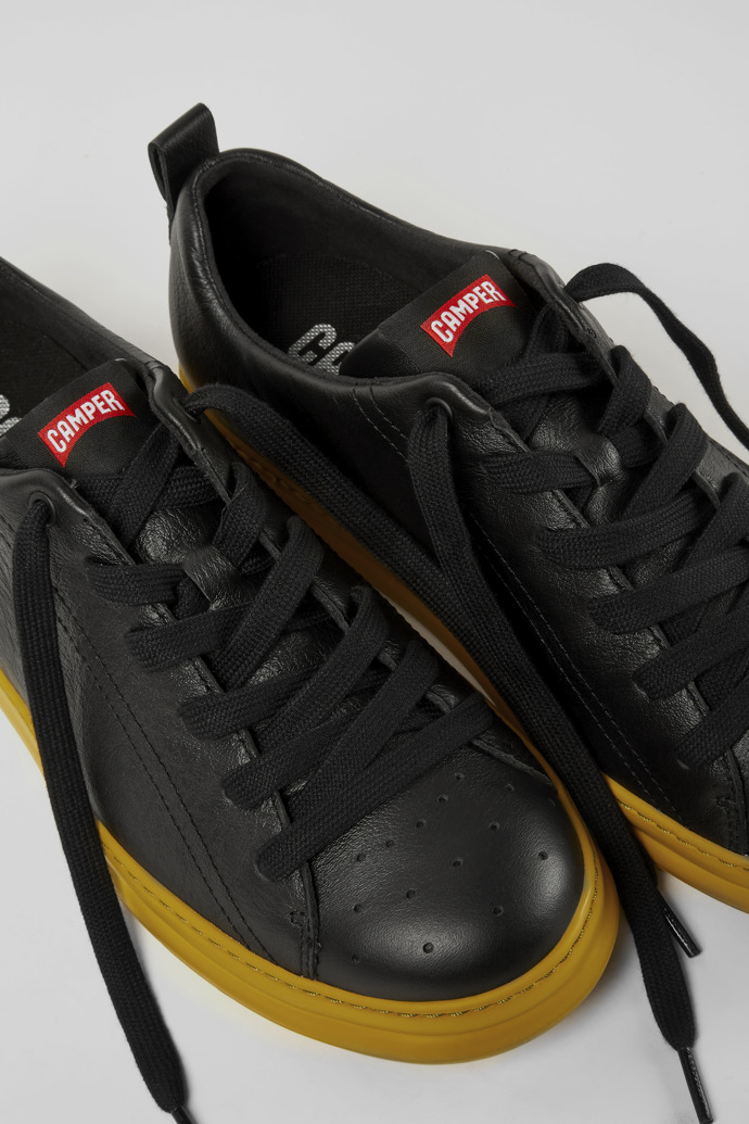 Close-up view of Runner Black leather sneakers