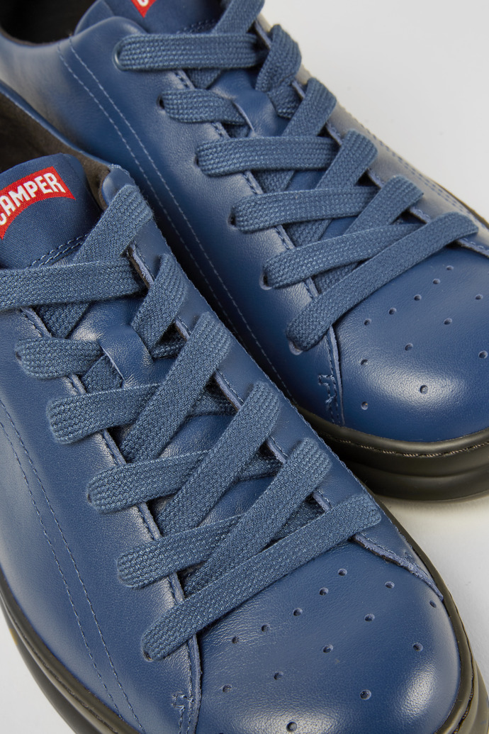 Close-up view of Runner Blue leather sneakers
