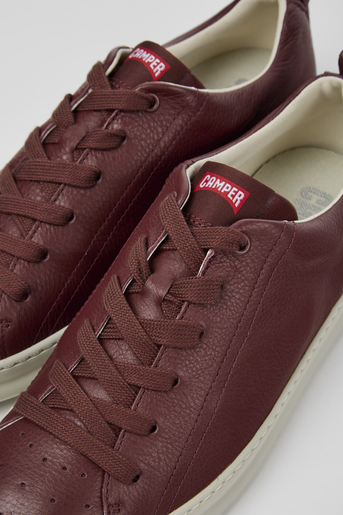 Close-up view of Runner Burgundy leather sneakers