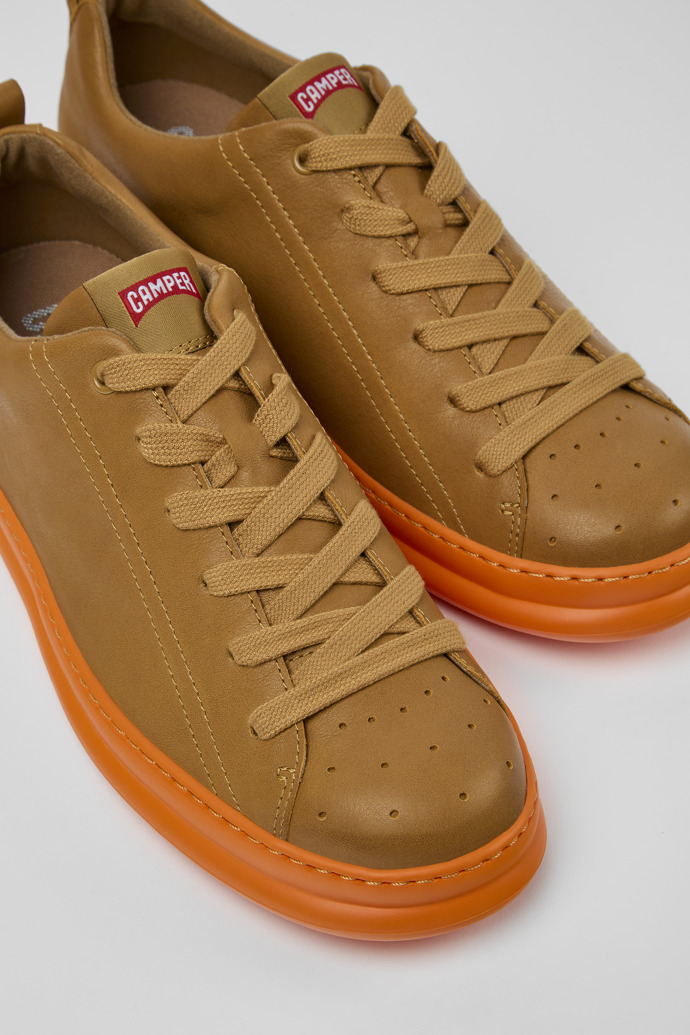 Close-up view of Runner Brown leather sneakers