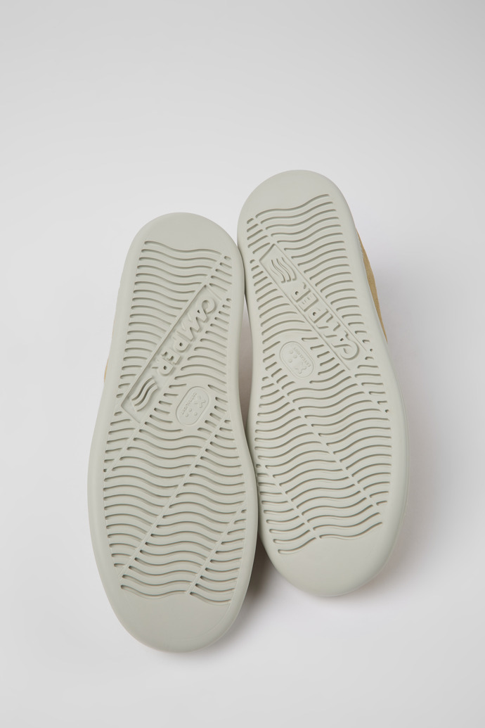 The soles of Runner Beige nubuck sneakers for men