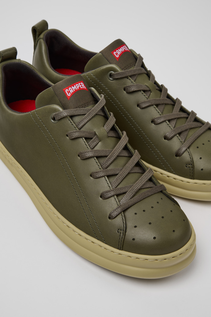 Close-up view of Runner Green Leather Men's Sneakers.