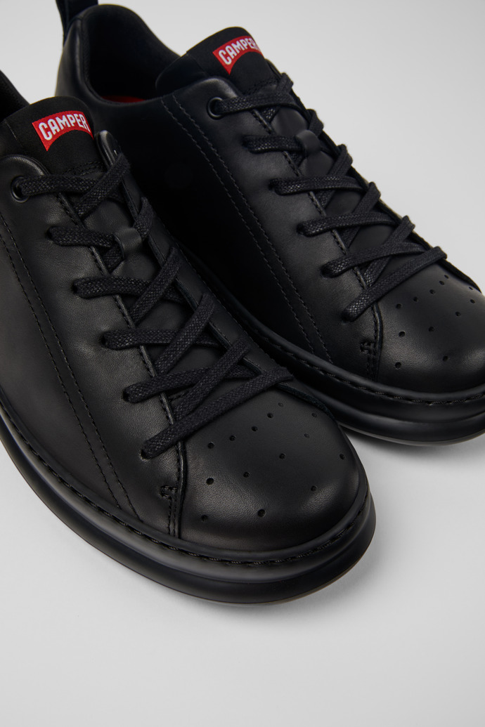 Close-up view of Runner Black leather sneakers for men