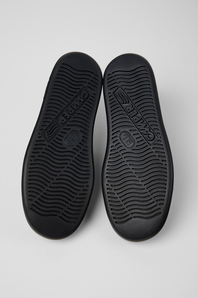 The soles of Runner Black leather sneakers for men