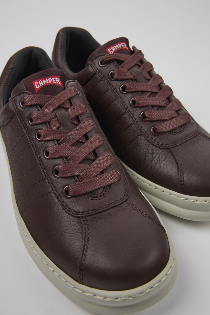 Close-up view of Runner Burgundy leather sneakers for men