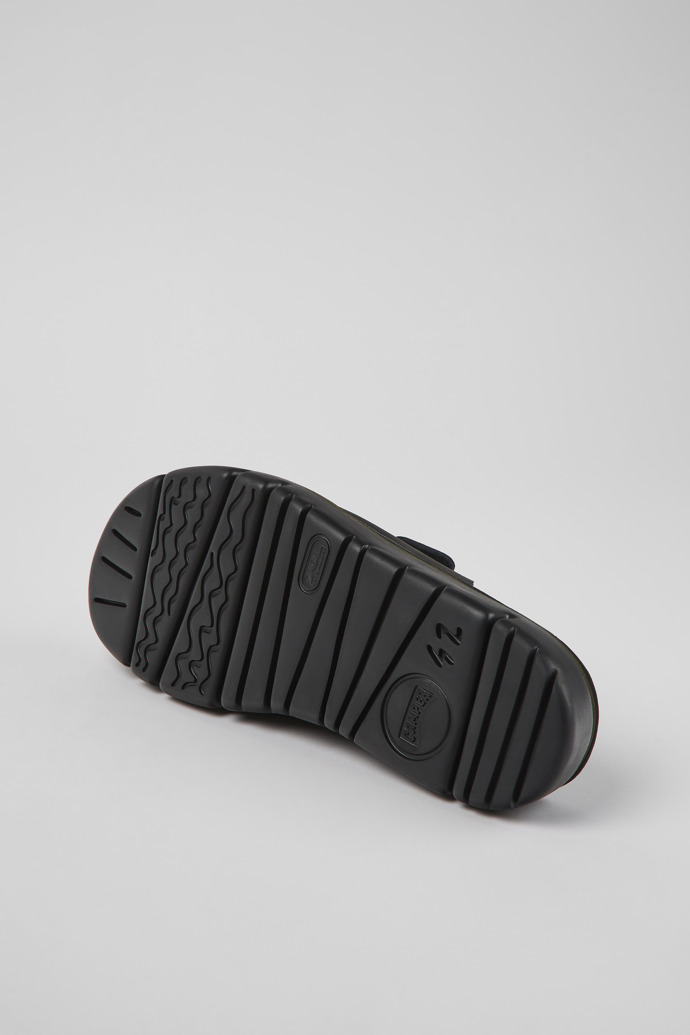 The soles of Oruga Black Leather Slide for Men