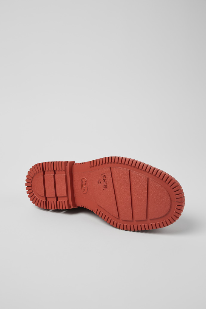 The soles of Pix Red and brown shoes for men