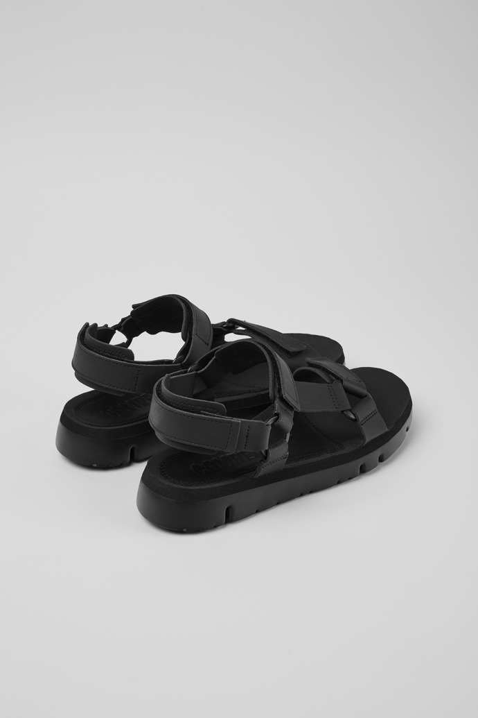 Back view of Oruga Black leather sandals for men