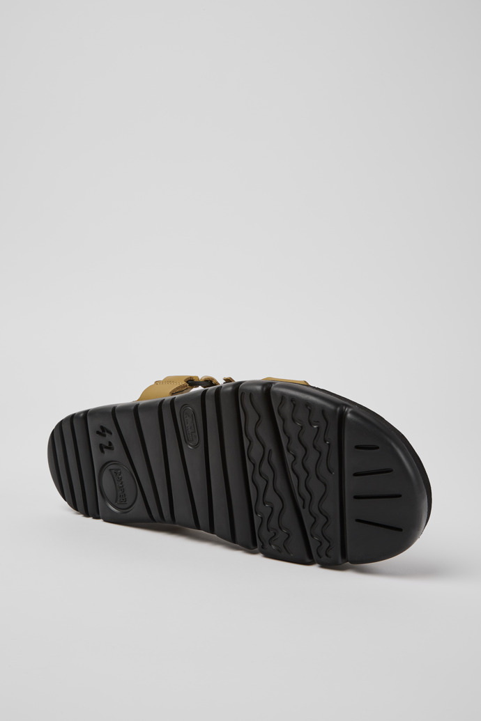 The soles of Oruga Brown leather sandals for men