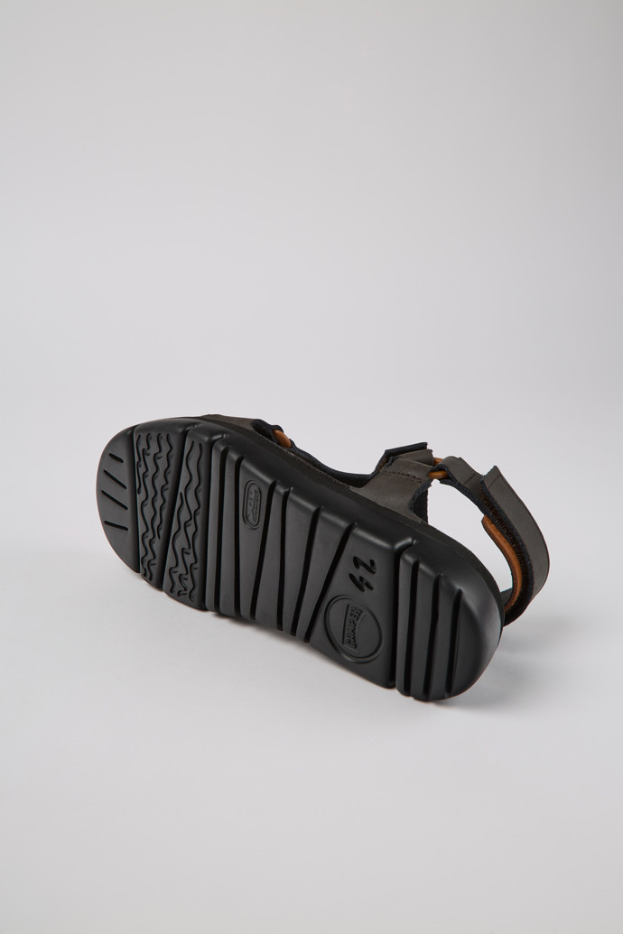 The soles of Oruga Brown leather sandals for men