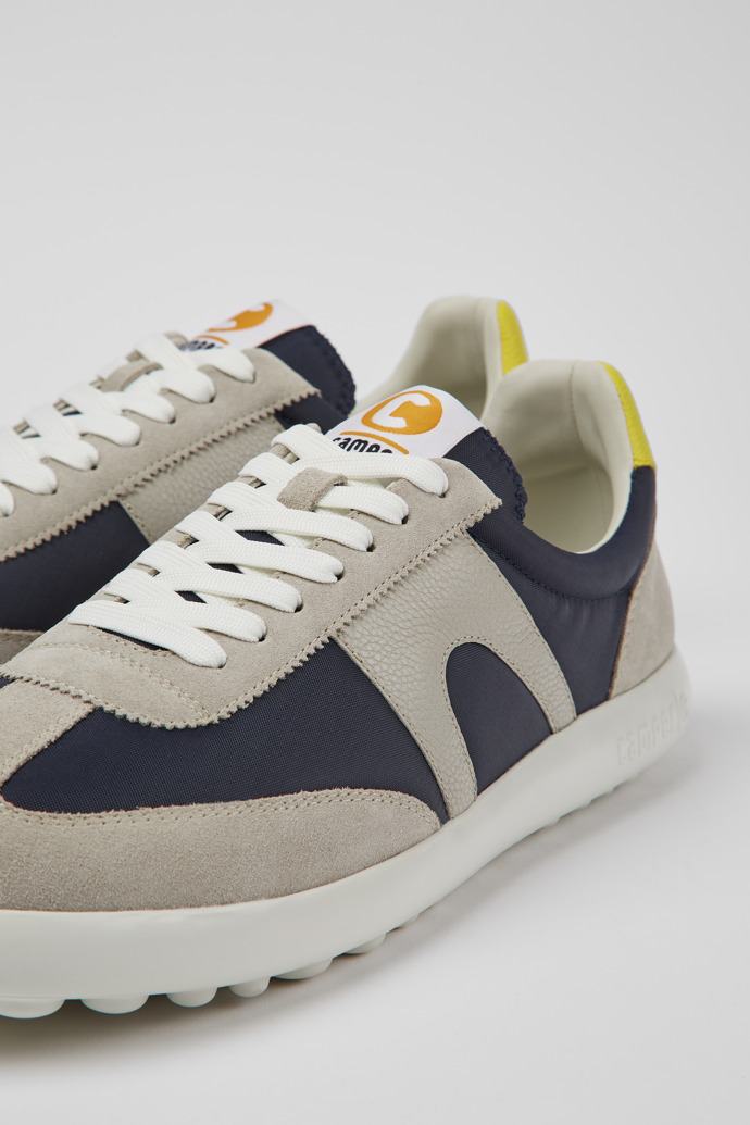 Close-up view of Pelotas XLite Blue, grey, and yellow sneakers for men