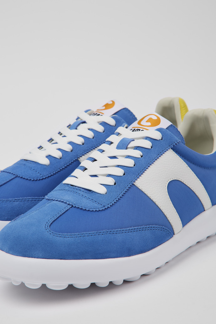 Close-up view of Pelotas XLite Blue and white sneakers for men