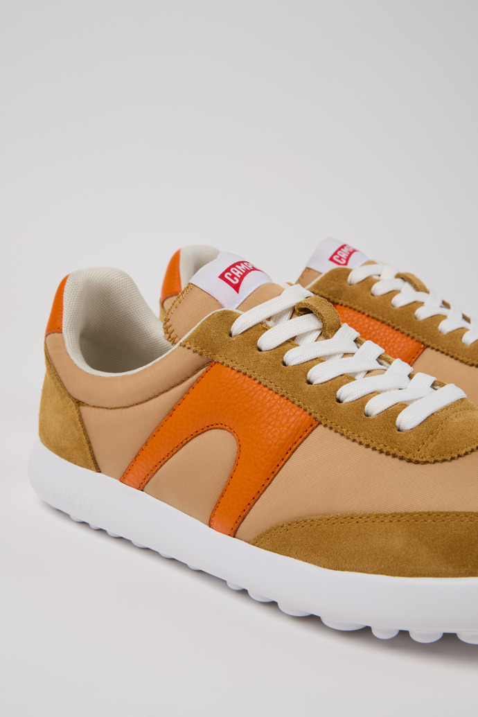 Close-up view of Pelotas XLite Brown and orange sneakers for men