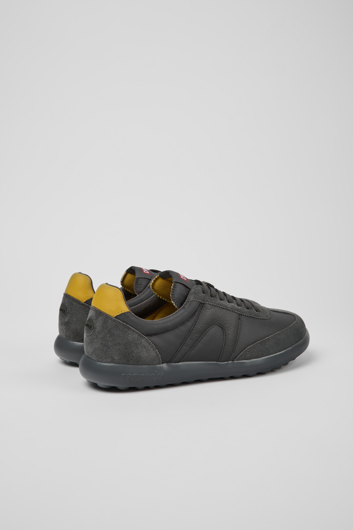 Back view of Pelotas XLite Gray and yellow sneakers for men