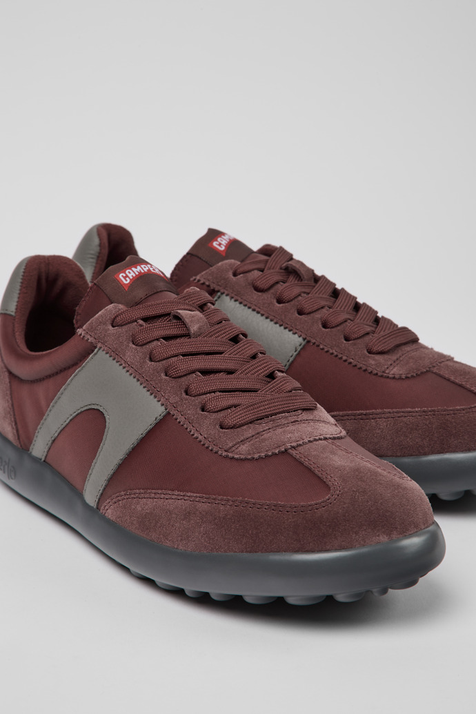 Close-up view of Pelotas XLite Burgundy and gray sneakers for men