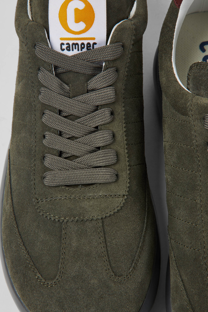 Close-up view of Pelotas XLite Green suede sneakers for men