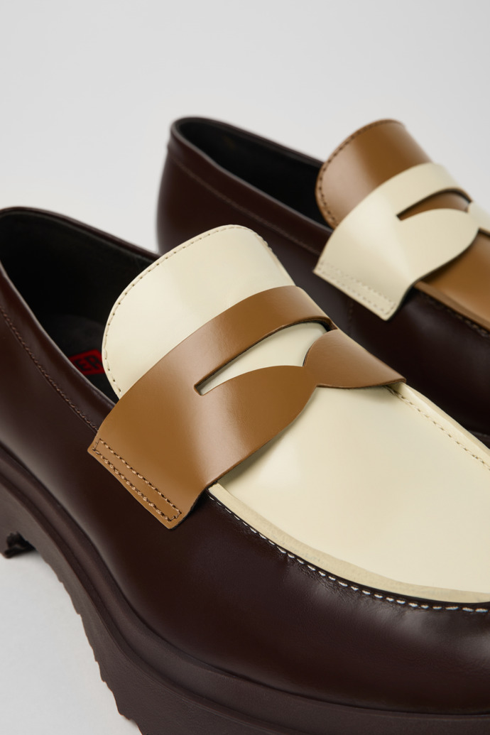 Close-up view of Twins Brown and white leather loafers for men