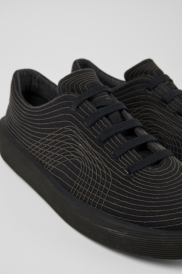 Close-up view of Courb Black sneakers for men