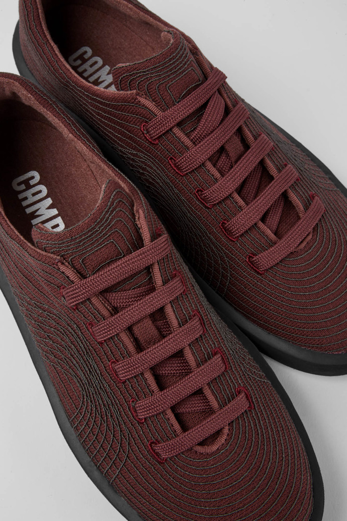 Close-up view of Courb Burgundy sneakers for men
